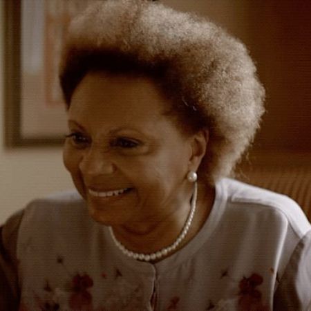 Leslie Uggams is smiling at someone in the picture.